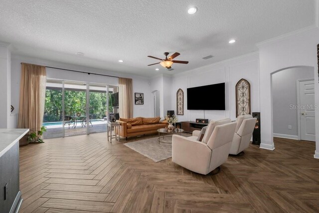 15934 Sorawater Dr, Lithia, FL 33547 - living room featuring a textured ceiling, ceiling fan, crown molding, recessed lighting, and arched walkways