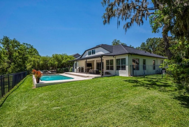 15934 Sorawater Dr, Lithia, FL 33547 - rear view of property featuring a fenced backyard, stucco siding, and a patio