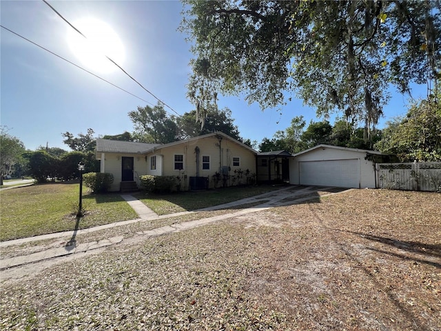 403 E Carolina Ave, Plant City, FL 33563 - single story home featuring an attached garage, driveway, and central AC