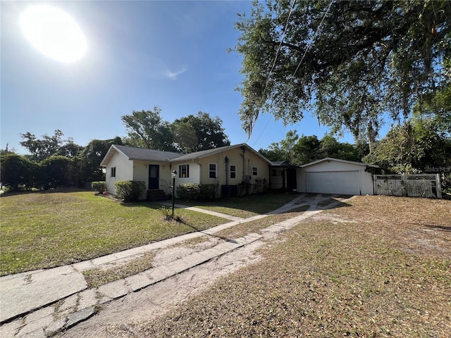 403 E Carolina Ave, Plant City, FL 33563 - ranch-style house with dirt driveway and an attached garage