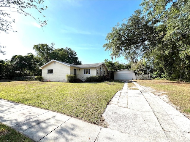 403 E Carolina Ave, Plant City, FL 33563 - ranch-style home with concrete driveway, a detached garage, and an outdoor structure