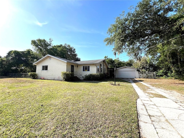 403 E Carolina Ave, Plant City, FL 33563 - ranch-style house with concrete driveway, a garage, and an outbuilding