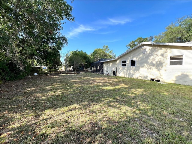 403 E Carolina Ave, Plant City, FL 33563 - view of grassy yard with central AC