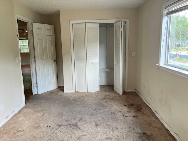 403 E Carolina Ave, Plant City, FL 33563 - unfurnished bedroom featuring a closet, carpet, and baseboards