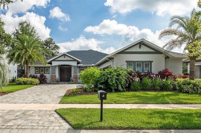 5314 Alafia Falls Dr, Lithia, FL 33547 - view of front facade with stucco siding and a front lawn
