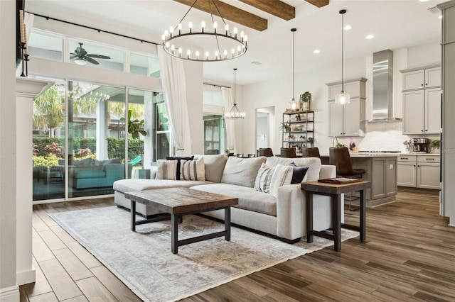 5314 Alafia Falls Dr, Lithia, FL 33547 - living room with a chandelier, beam ceiling, dark wood-style floors, a high ceiling, and recessed lighting
