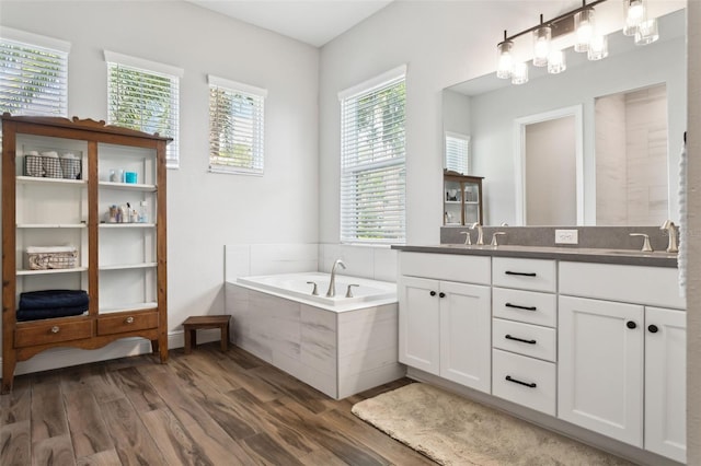 5314 Alafia Falls Dr, Lithia, FL 33547 - full bath featuring double vanity, a bath, and wood finished floors