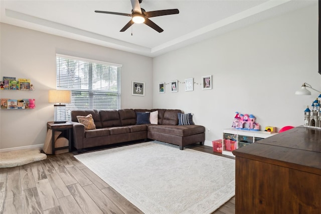 5314 Alafia Falls Dr, Lithia, FL 33547 - living area with ceiling fan, light wood-style floors, and baseboards