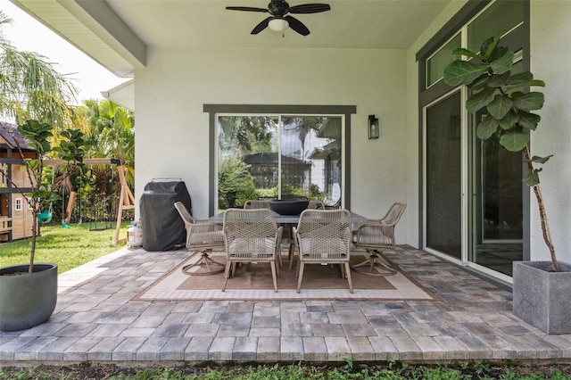 5314 Alafia Falls Dr, Lithia, FL 33547 - view of patio with a playground, ceiling fan, outdoor dining space, and area for grilling