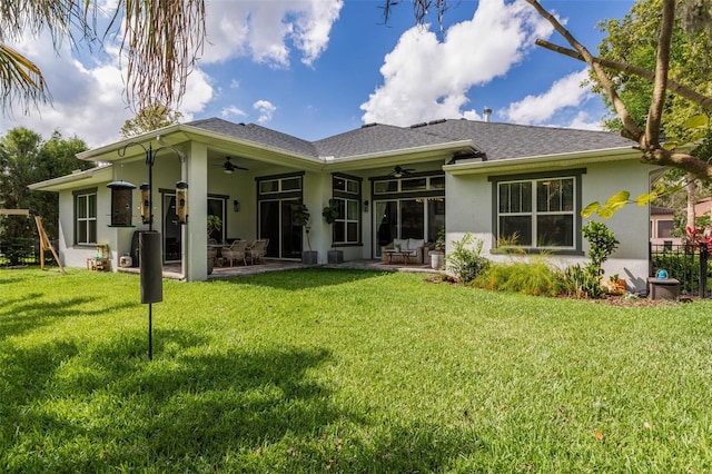 5314 Alafia Falls Dr, Lithia, FL 33547 - back of property with a ceiling fan, stucco siding, and a patio area
