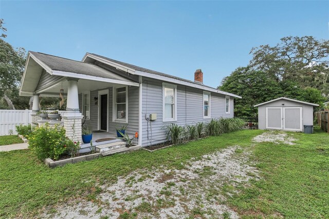 1206 E Frierson Ave Unit B, Tampa, FL 33603 - view of side of home with a chimney and a porch