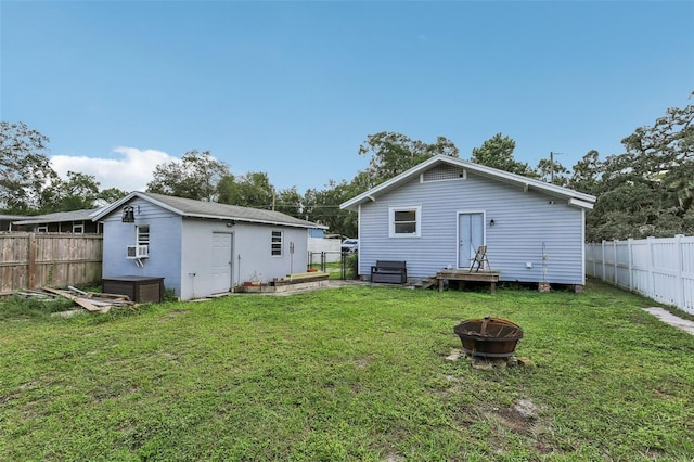 1206 E Frierson Ave Unit B, Tampa, FL 33603 - back of house with a fire pit, cooling unit, and an outbuilding