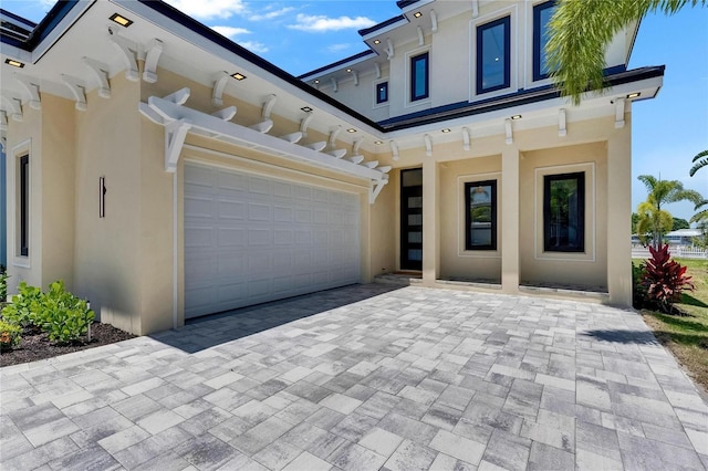 6522 Simone Shores Cir, Apollo Beach, FL 33572 - view of front of home featuring stucco siding and decorative driveway