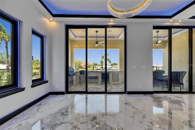 6522 Simone Shores Cir, Apollo Beach, FL 33572 - unfurnished room with a raised ceiling, a ceiling fan, baseboards, marble tiled floors, and recessed lighting