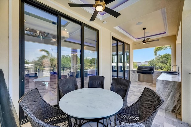 6522 Simone Shores Cir, Apollo Beach, FL 33572 - view of patio / terrace with a ceiling fan, exterior kitchen, outdoor dining space, and a sink