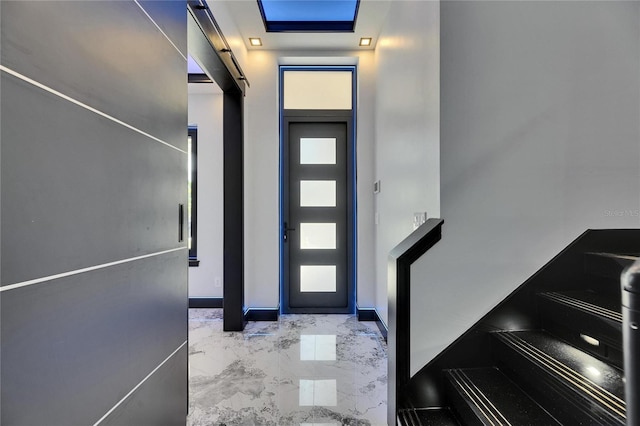 6522 Simone Shores Cir, Apollo Beach, FL 33572 - foyer featuring marble finish floors and baseboards