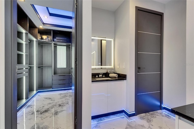 6522 Simone Shores Cir, Apollo Beach, FL 33572 - bathroom with marble tiled floors and vanity