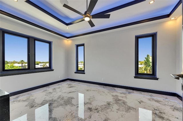 6522 Simone Shores Cir, Apollo Beach, FL 33572 - empty room featuring a raised ceiling, light marble finish flooring, ceiling fan, recessed lighting, and baseboards