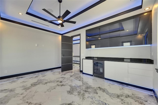 6522 Simone Shores Cir, Apollo Beach, FL 33572 - spare room featuring beverage cooler, a dry bar, ceiling fan, a raised ceiling, and recessed lighting