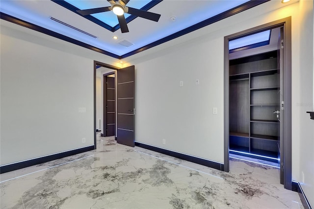 6522 Simone Shores Cir, Apollo Beach, FL 33572 - unfurnished bedroom with marble tiled flooring, baseboards, recessed lighting, a tray ceiling, and a closet