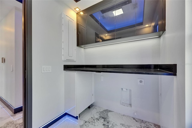 6522 Simone Shores Cir, Apollo Beach, FL 33572 - bathroom with marble look tiles and electric panel