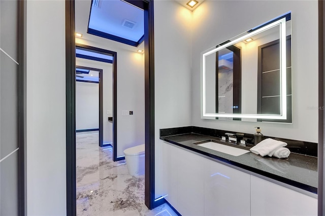 6522 Simone Shores Cir, Apollo Beach, FL 33572 - bathroom featuring marble tiled flooring, toilet, and vanity