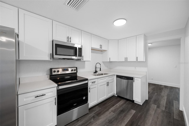 5109 Horton Rd, Plant City, FL 33567 - kitchen with appliances with stainless steel finishes, a sink, light countertops, and white cabinets