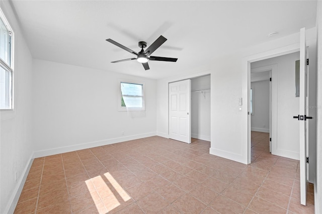 5109 Horton Rd, Plant City, FL 33567 - unfurnished bedroom with a closet, light tile patterned floors, ceiling fan, and baseboards
