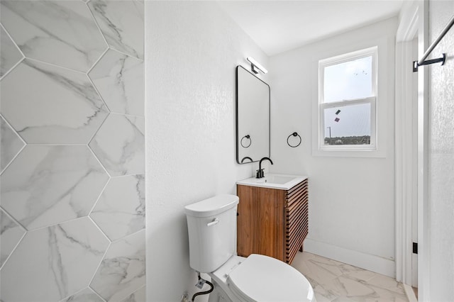 5109 Horton Rd, Plant City, FL 33567 - bathroom with marble finish floors, toilet, vanity, and baseboards