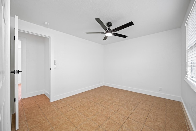 5109 Horton Rd, Plant City, FL 33567 - spare room with a ceiling fan, plenty of natural light, baseboards, and light tile patterned floors