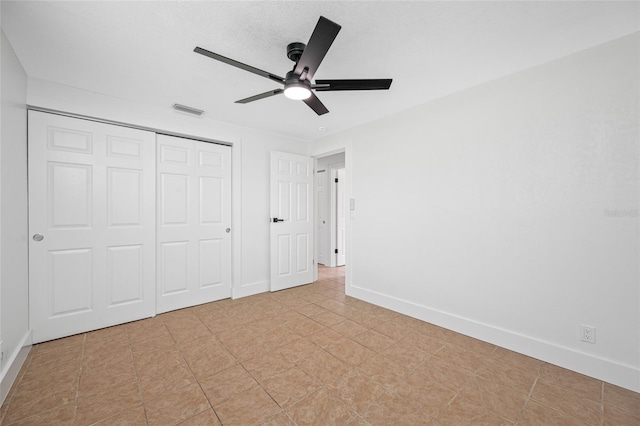 5109 Horton Rd, Plant City, FL 33567 - unfurnished bedroom featuring a closet, baseboards, and a ceiling fan
