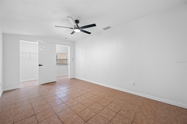 5109 Horton Rd, Plant City, FL 33567 - unfurnished room with a ceiling fan, light tile patterned floors, and baseboards