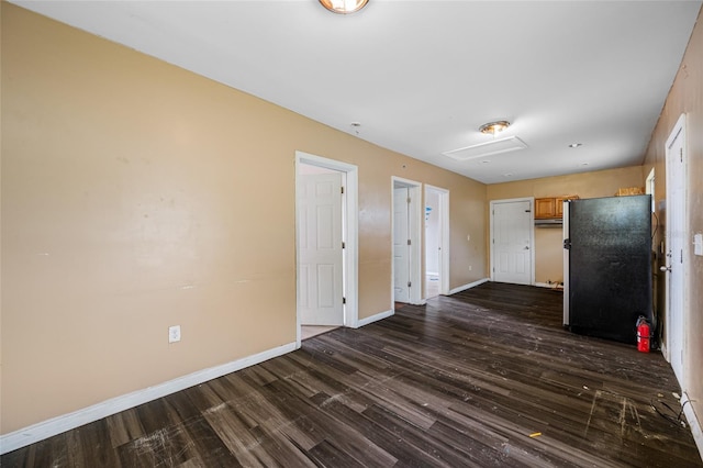 5109 Horton Rd, Plant City, FL 33567 - unfurnished living room with dark wood-type flooring and baseboards