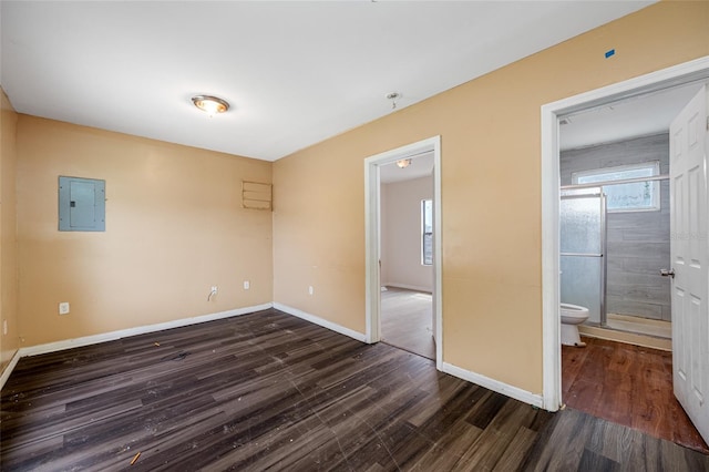 5109 Horton Rd, Plant City, FL 33567 - spare room with electric panel, dark wood finished floors, and baseboards