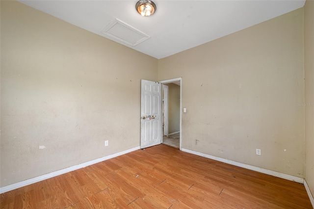 5109 Horton Rd, Plant City, FL 33567 - unfurnished room with light wood finished floors, attic access, and baseboards