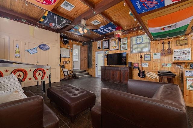 6114 7th Ave S, Gulfport, FL 33707 - living room featuring wood walls, ceiling fan, wood ceiling, and stairway