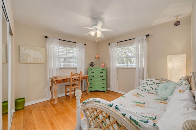 6114 7th Ave S, Gulfport, FL 33707 - bedroom featuring light wood-style floors, baseboards, and ceiling fan