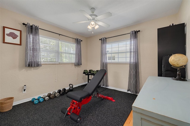 6114 7th Ave S, Gulfport, FL 33707 - workout room featuring baseboards and a ceiling fan