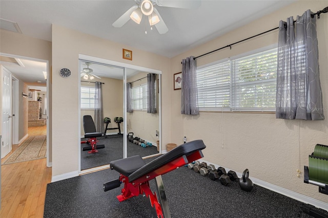 6114 7th Ave S, Gulfport, FL 33707 - exercise area with a ceiling fan and wood finished floors