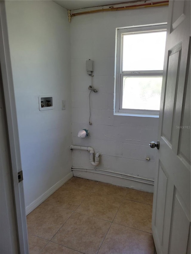 6434 Old Main St, New Port Richey, FL 34653 - bathroom featuring tile patterned flooring and baseboards