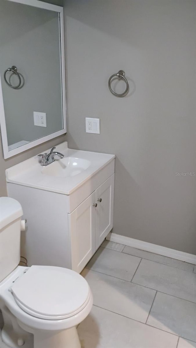 6434 Old Main St, New Port Richey, FL 34653 - bathroom featuring vanity, toilet, and baseboards