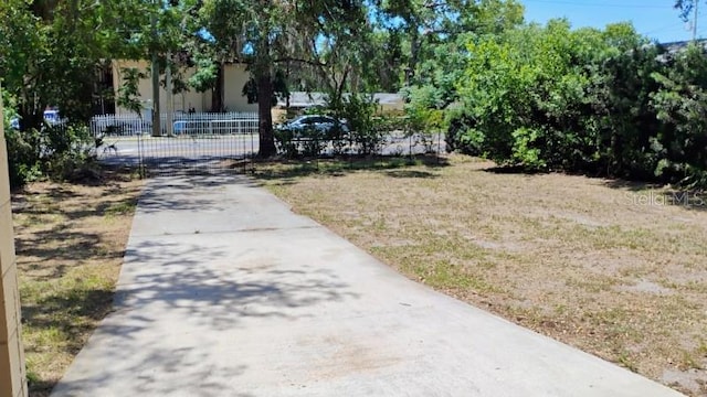 6434 Old Main St, New Port Richey, FL 34653 - view of yard with driveway and a gate