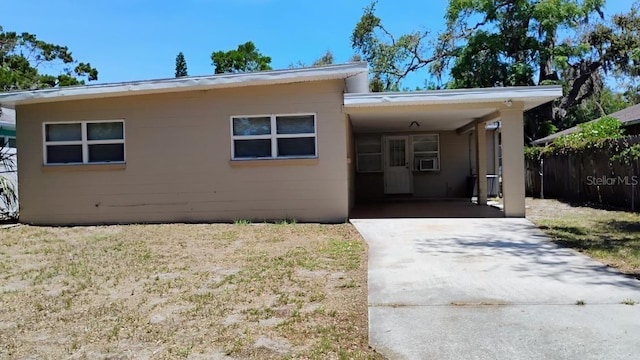 6434 Old Main St, New Port Richey, FL 34653 - view of front facade featuring concrete driveway, a carport, and concrete block siding