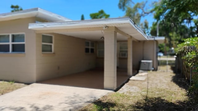 6434 Old Main St, New Port Richey, FL 34653 - view of home's exterior with a carport and driveway