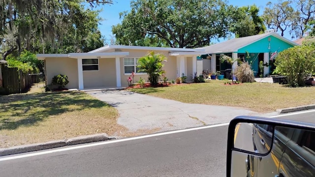 6434 Old Main St, New Port Richey, FL 34653 - ranch-style home with stucco siding and driveway