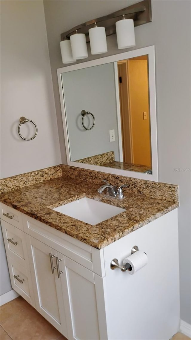 6434 Old Main St, New Port Richey, FL 34653 - bathroom with vanity, baseboards, and tile patterned flooring