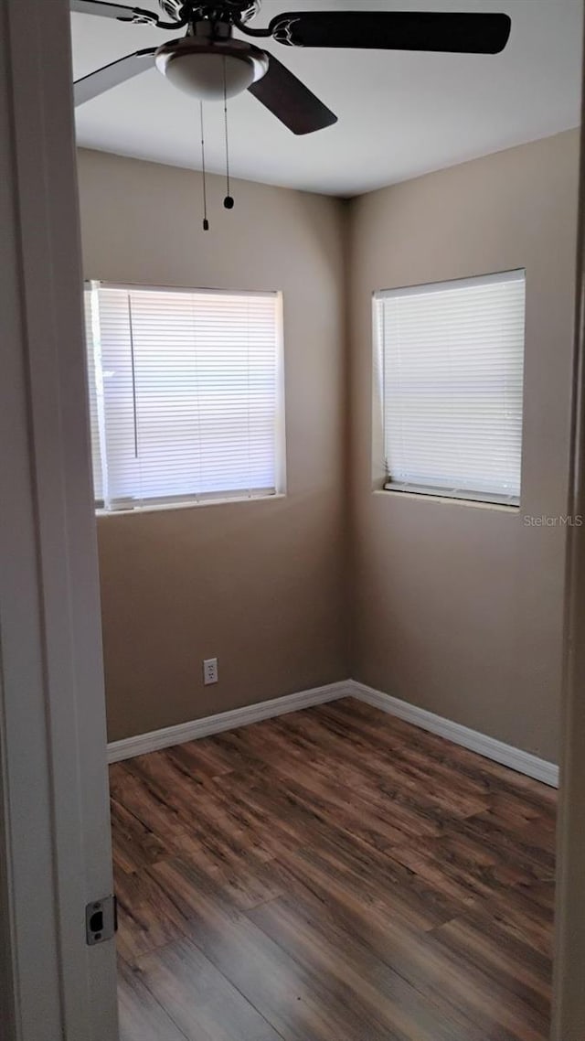 6434 Old Main St, New Port Richey, FL 34653 - empty room featuring a ceiling fan, wood finished floors, and baseboards