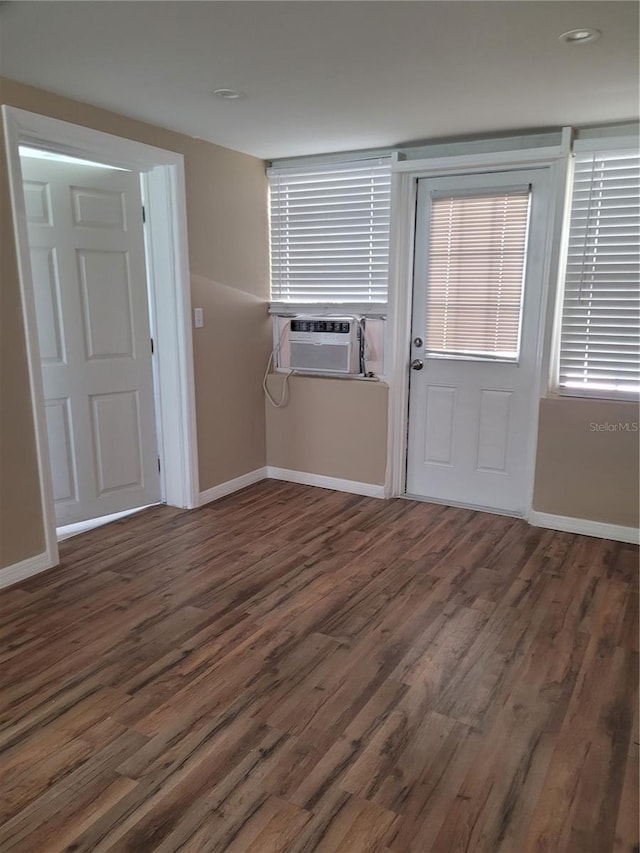 6434 Old Main St, New Port Richey, FL 34653 - entrance foyer featuring cooling unit, wood finished floors, and baseboards