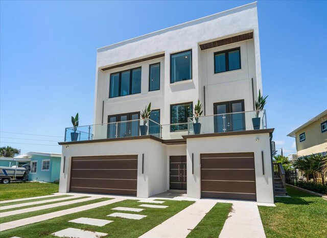 16047 Redington Dr, Redington Beach, FL 33708 - contemporary house with a balcony, stucco siding, a garage, and a front yard