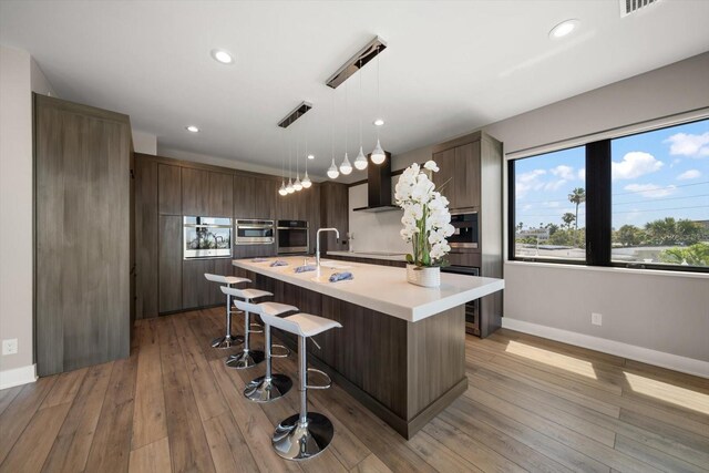 16047 Redington Dr, Redington Beach, FL 33708 - kitchen with stainless steel oven, light countertops, modern cabinets, baseboards, and recessed lighting